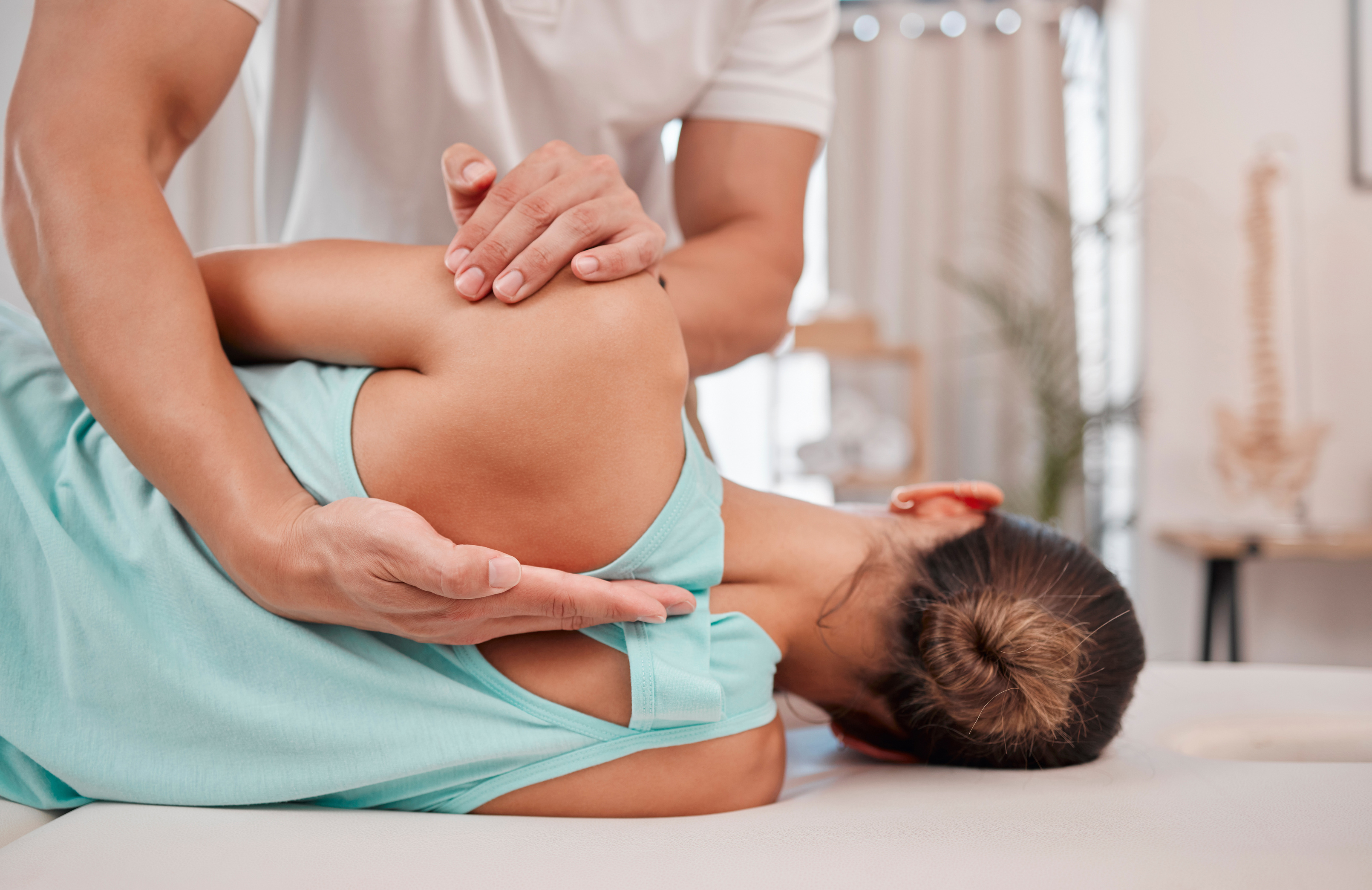 Doctor, Chiropractor and Woman with Back Pain for Physiotherapy from a Physiotherapist Helping with Spine Alignment. Rehabilitation and Chiropractic Worker Healing a Healthy Girls Spinal Posture